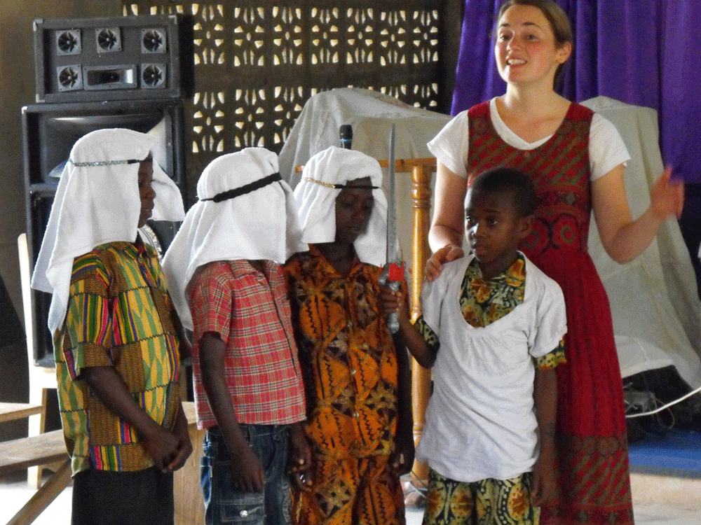 Woman teaching a group of children